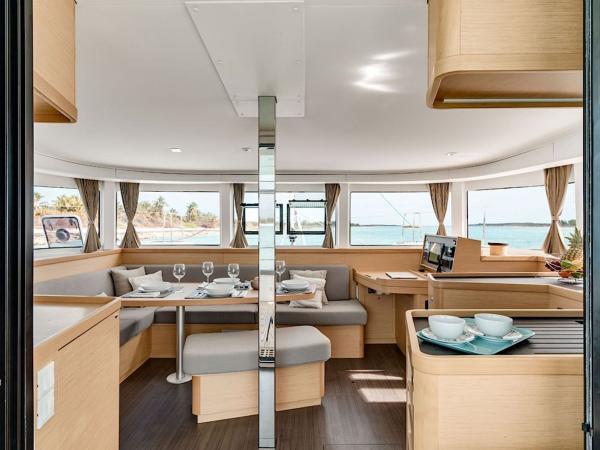 Indoor dining area onboard Lagoon 42 catamaran Sardinia cabin charter