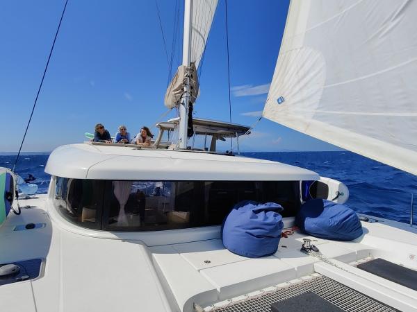 Relaxing on the deck of Lagoon 42 on wellness sailing holiday