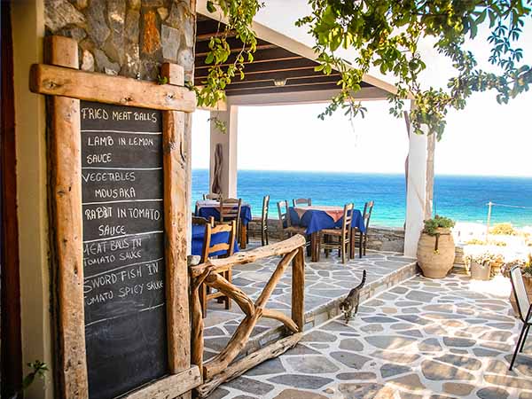 A Taverna in Ios, Greece with the chalk menu-board outside.