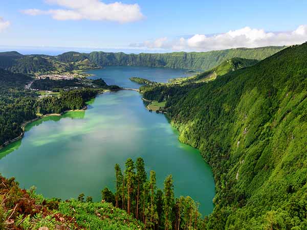 Amazing Azorean landscape. Panoramic view of the lake of Sete Cidades, Azores, Portugal. Viewpoint Vista do Rei at Sao Miguel. The Azores are one of the main tourist destinations in Portugal