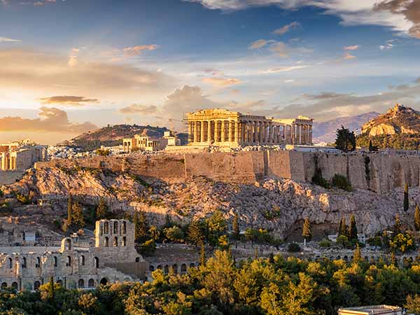 The Acropolis of Athens, Greece, with the Parthenon Temple on top of the hill during a summer sunset