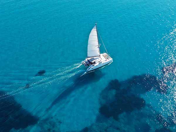 Catamaran sailing on turquoise waters
