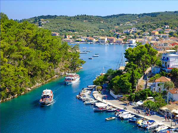 Paxos island with boat entering the grand canal