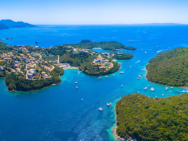 Aerial view of iconic paradise sandy beaches with turquoise sea in complex islands of Agios Nikolaos and Mourtos in Sivota area, Epirus, Greece