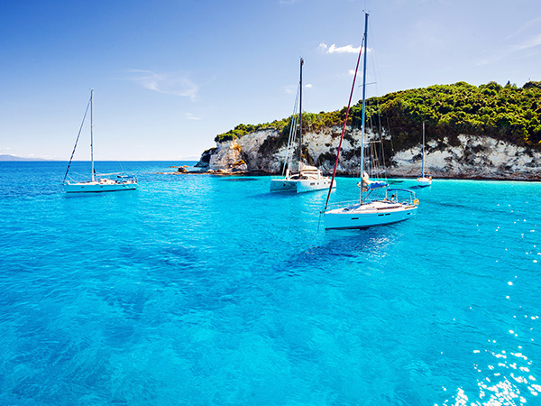 Sailboats in a beautiful bay, Paxos island, Greece