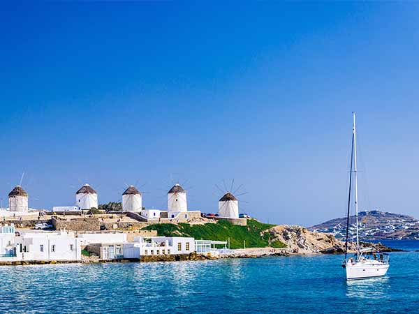 Romantic famous windmills of Mykonos on a bright summer day, Mykonos, Cyclades, Greece