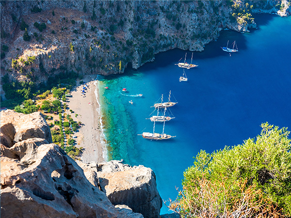 Butterfly Valley (Turkish: Kelebekler Vadisi) is a valley in Fethiye district, Mugla Province, on the Mediterranean coast of Turkey. Oludeniz - Fethiye, Mugla, Turkey.