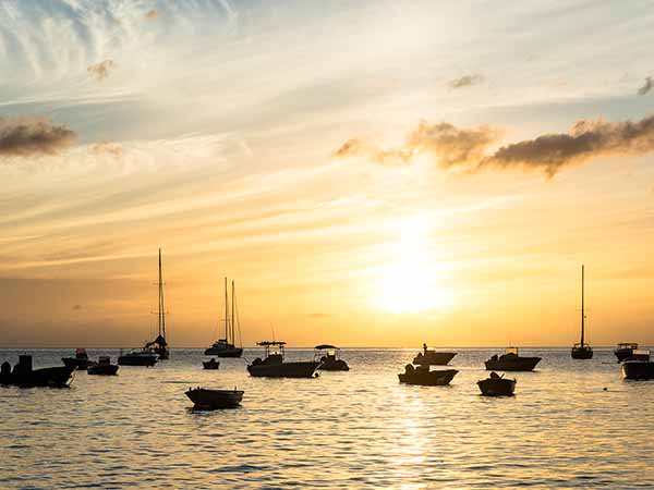 silhouetted fisher boats in the bay of 