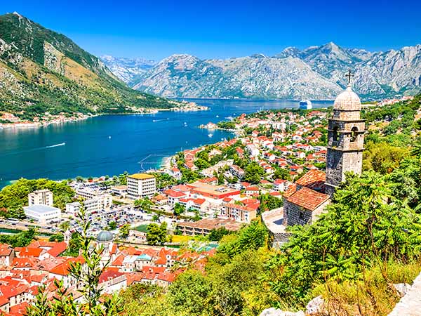 Kotor, Montenegro. Bay of Kotor bay is one of the most beautiful places on Adriatic Sea, it boasts the preserved Venetian fortress, old tiny villages, medieval towns and scenic mountains.