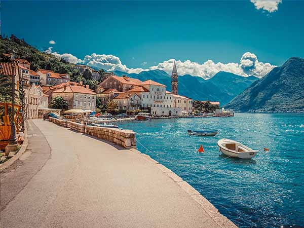 Harbour and boats in sunny day at Boka Kotor bay (Boka Kotorska), Montenegro, Europe