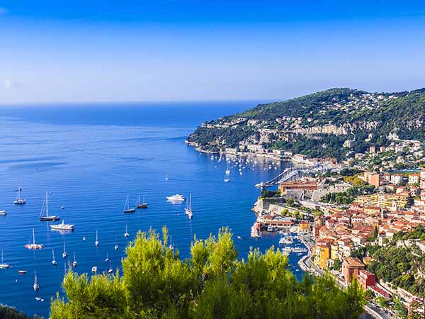 View of Mediterranean luxury resort and bay with yachts. Nice, Cote d'Azur, France. French Riviera - turquoise sea and perfect recreation.