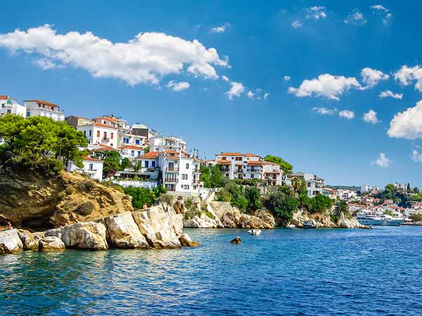 Skiathos town on Skiathos Island, Greece. Beautiful view of the old town with boats in the harbor.