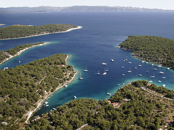 Sailing boats in quiet bay near village Milna on island Brac in Croatia