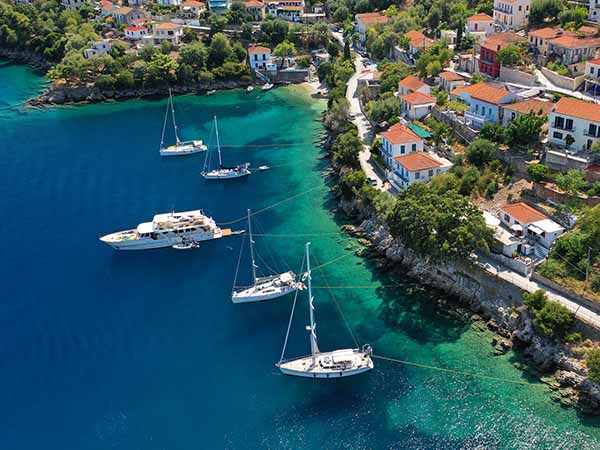 Aerial drone photo of picturesque beautiful seaside village of Kioni a safe anchorage for yachts and sail boats, a true gem of Ithaki or Ithaca island, Ionian, Greece